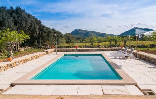 a swimming pool with a view of a mountain at Son Frare in Artá
