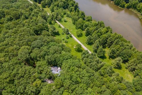 an aerial view of a forested area next to a river at Meadow Lake View by Railey Vacations in Swanton