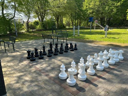 a giant chess set on a brick ground at Hasenfeldlodges in Sögel