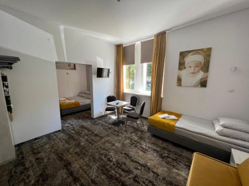 a hotel room with a bed and a table at HORIZON in Ustka
