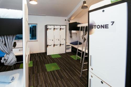 a dorm room with bunk beds and a doorway at Hostel 365 For U in Dubrovnik