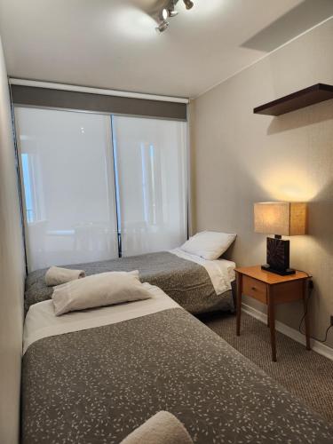 Llit o llits en una habitació de Departamento Reñaca