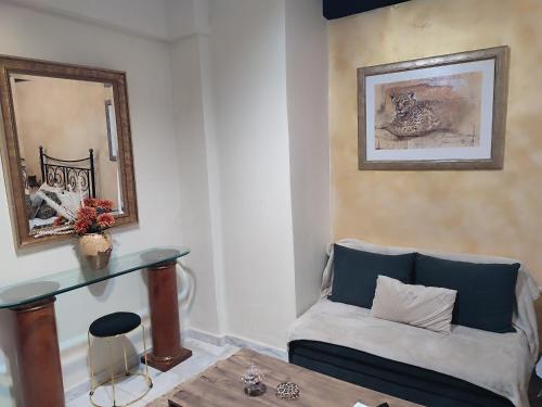 a living room with a couch and a table at Anatolia in Veria