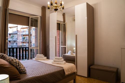 a bedroom with a bed with towels on it at casa Aldini in Rome