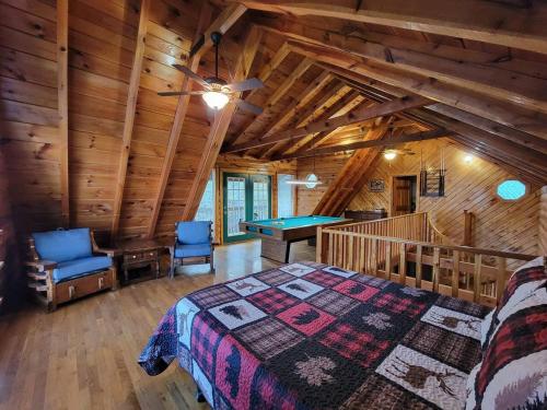 a bedroom with a bed and a pool table at Mountain Rose- Hot Tub, Pool Table, Firepit in Stanton