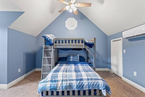 a room with a bunk bed and a ceiling fan at Hidden Treasure- Private Pool, Pond, 1600 Acres in Clay City