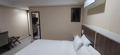 Krevet ili kreveti u jedinici u okviru objekta Ideal Hotel