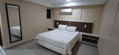 Krevet ili kreveti u jedinici u okviru objekta Ideal Hotel