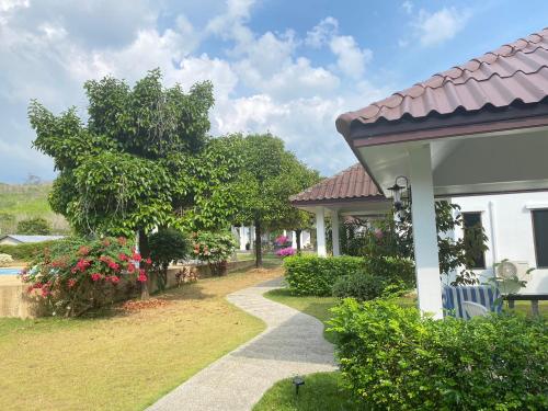 a house with a garden and a walkway at The1 Mangosteen Harmony Retreat - Khaolak - Eco Luxury Villa - Room Only -No Breakfast in Khao Lak