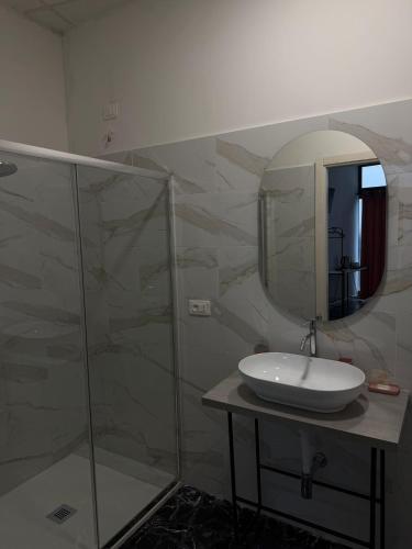 a bathroom with a sink and a mirror at Rooms 78 in Castel di Sangro