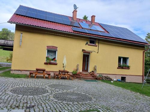 a house with solar panels on the roof at Zacisze Sokolec in Ludwikowice Kłodzkie