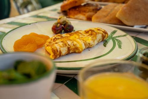 a plate of breakfast food on a table at Riad JAIA in Marrakesh