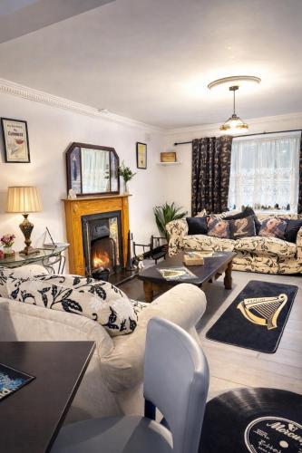 a living room with a couch and a fireplace at Gra accommodations athy in Athy