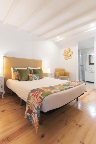 a bedroom with a large bed in a room at Douro by your side with Pool in Vila Nova de Gaia
