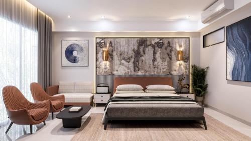 a bedroom with a bed and a couch at Hotel Presidency in Surat
