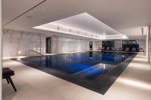a large swimming pool in a building at Aldwark Manor Estate in Aldwark