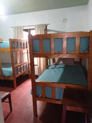 a room with two bunk beds in a room at Lozano Casa de Campo in Lozano