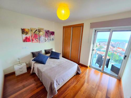 a bedroom with a bed and a large window at Spacious Summer Fresh Family Apartment with Panoramic Sea Views in Funchal in Funchal
