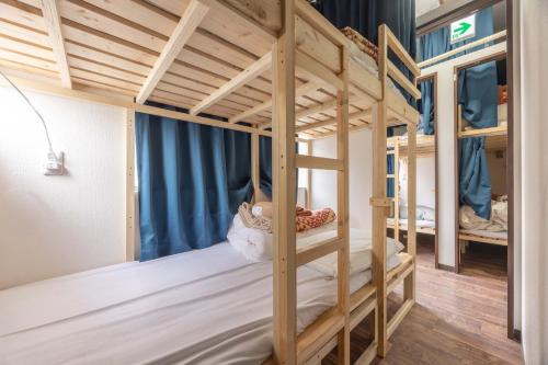 a bunk bed room with two bunk beds at Akabane Dormitory-Men Only in Tokyo