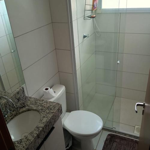a bathroom with a shower and a toilet and a sink at MaM TORRE DOS HOLANDESES in São Luís