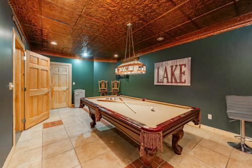 a pool table in a room with a ceiling at Cozy Cabin by Railey Vacations in Oakland