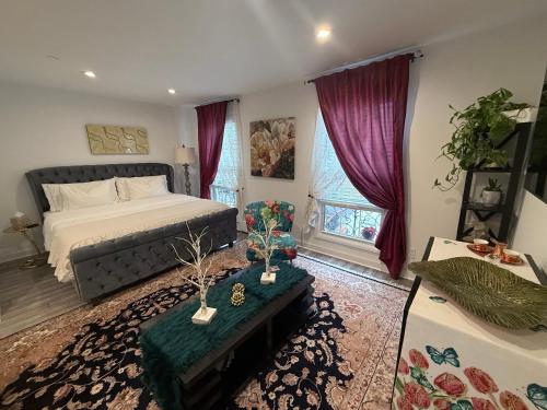 a bedroom with a bed and a table in a room at Eleni’s Charming Studio in North Beach