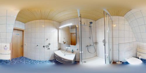 a large bathroom with a shower and a sink at Apartment Schlager Maria in Pirkach