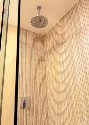 a shower with a shower curtain in a bathroom at Pousada Filó in Fernando de Noronha