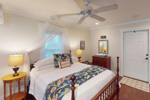 a bedroom with a bed and a ceiling fan at Steps to Riverfront: Dtwn Bluffton Studio! in Bluffton