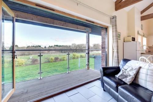 a living room with a large sliding glass door at 2 Bed in Cardiff oc-91126 in Cardiff