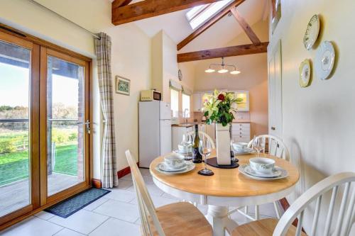 a kitchen and dining room with a table and chairs at 2 Bed in Cardiff oc-91126 in Cardiff
