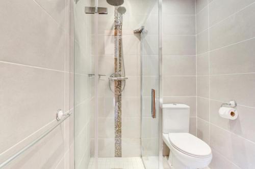 a bathroom with a shower with a toilet at 2 Bed in Cardiff oc-91126 in Cardiff