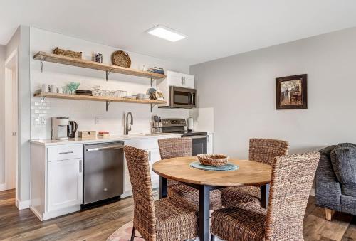 a kitchen and dining room with a table and chairs at Riverfront Studio in Downtown Bend in Bend