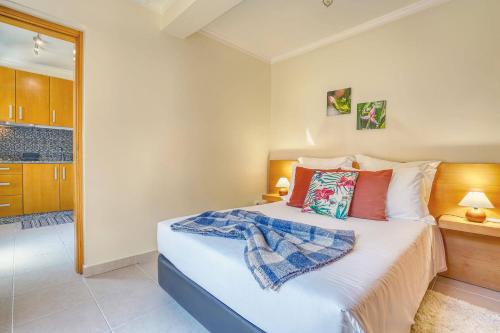 a bedroom with a large bed in a room at Vilamar 2 - Madeira Inn Group in Calheta