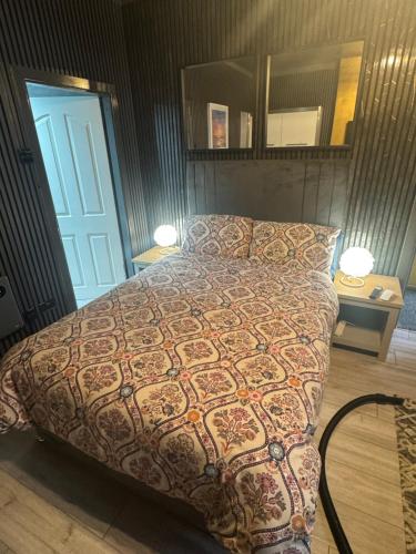 a bedroom with a bed and a blue door at Reads Avenue - Luxury Ground Floor Studio - Next Door to H&A Social Club in Blackpool