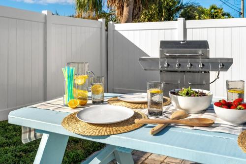 a blue picnic table with food and drinks on it at 332 Formosa Drive in Cocoa Beach