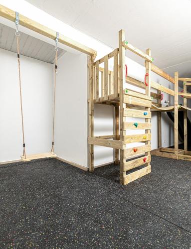 a room with a bunk bed and a ladder at Private Paradise Nuremberg in Nuremberg