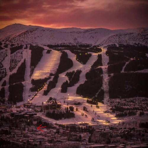 a view of a city with a snow covered mountain at GO-34B Large family cabin in Trysil next to the Gondole in Trysil