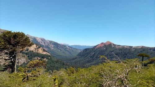 a view of a valley in the mountains at Cabaña Rakin Guilliw in Lonquimay