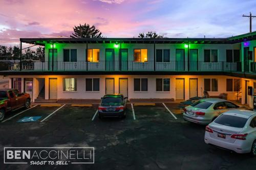 a building with cars parked in a parking lot at The mint in Rock Springs