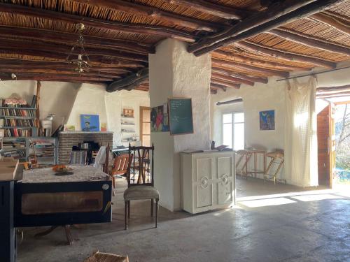 a large room with a table and chairs in it at Los Albergues in Pitres