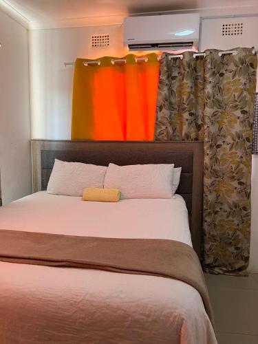 Llit o llits en una habitació de Qi BNB