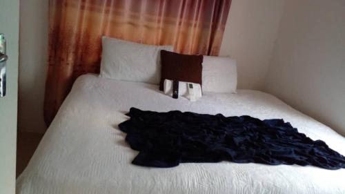 Llit o llits en una habitació de Qi BNB