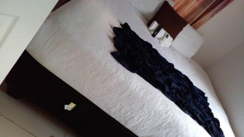 Llit o llits en una habitació de Qi BNB