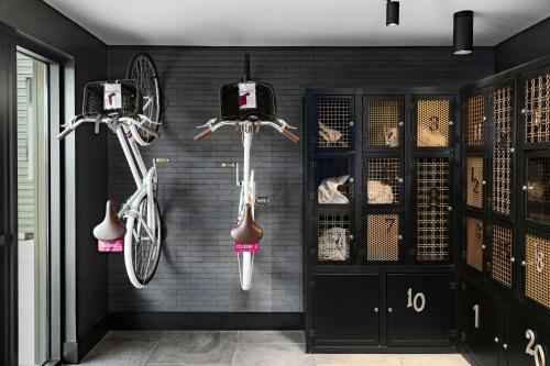 a room with two bikes hanging on a wall at Moxy Springfield Downtown in Springfield