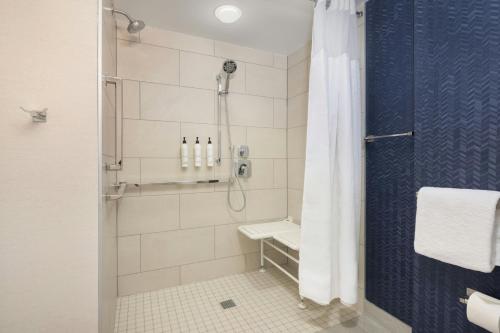 a bathroom with a shower with a shower curtain at Fairfield Inn Las Vegas Convention Center in Las Vegas