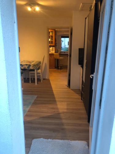 a hallway leading to a dining room and a kitchen with a table at Appartement Studio 2 Punat Insel Krk in Punat