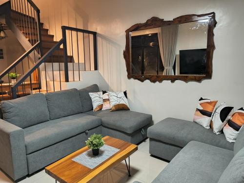 a living room with a couch and a table at Haven on the Hill near Twin Lakes in Calo