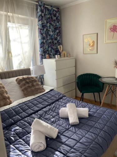 a bedroom with a bed with two pillows on it at Willa Zakopane Center in Zakopane