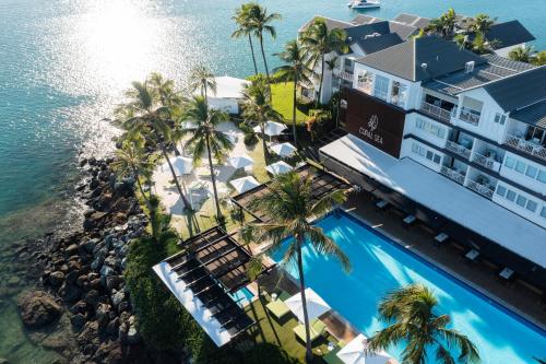 an aerial view of the hotel and the ocean at Coral Sea Resort in Airlie Beach